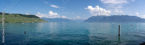 Fotografie Panoramic Lake Geneva waters with Alps on the horizon