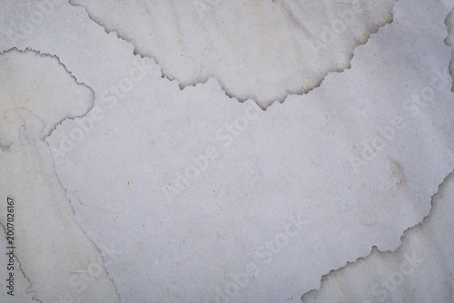 Foto Abstract background of old vintage paper with water stains, grungy weathered paper texture for antique design or scrapbooking