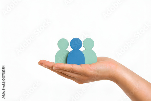 Close-Up Female Hand Holding Group of People Icon – Teamwork, Partnership, Business Strategy Concept,Collaboration, Leadership, Organization Concept,Business, Leadership, Human Resources Concept