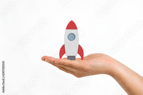Female Hand Holding Rocket Icon on White Background – Startup Growth and Innovation Concept,Business Launch, Success and Startup Concept,Innovation, Fast Growth and Business Success Idea