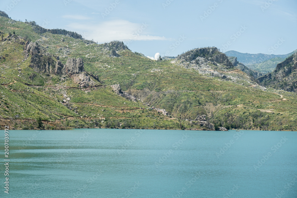 Naklejka premium Panoramic Landscape view on green canyon Antalya Turkey with turquoise water mountain cliffs and green forest. Showcasing natural beauty travel tourist destination. Vacation concept slowing down. 