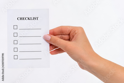 Female Hand Holding Checklist on White Background – Task Management, To Do List Concept,Planning, Organization, Productivity Concept,Business, Success, Goal Tracking Concept,Business, Success, Goal 