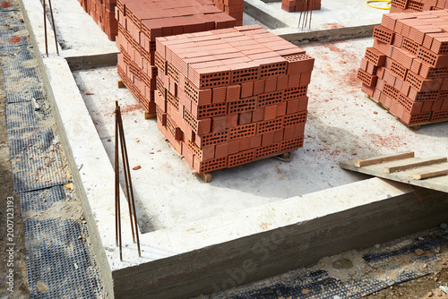  Bricks are neatly stacked on the construction site. Preparing materials for the construction of the building
