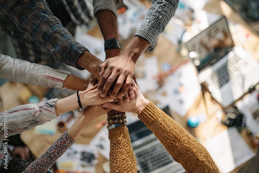 Obraz premium Diverse hands unite, symbolizing teamwork, collaboration, and shared purpose