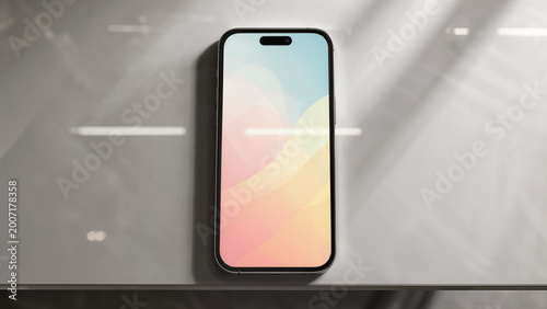 Overhead view on marble surface.
​Colorful abstract waves on display.
​Modern smartphone with pill-shaped notch.
​Soft pastel gradient wallpaper design.
​Bright reflections on glossy screen.