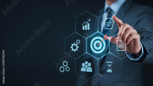 Businessman touching an icon of a document with a checkmark on a virtual screen, surrounded by other business and technology related icons.