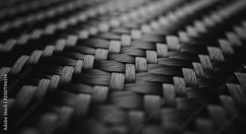 Obraz premium Macro close-up of woven carbon fiber texture