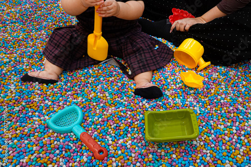 Playground with colorful mini gravel theme with play equipment accessories