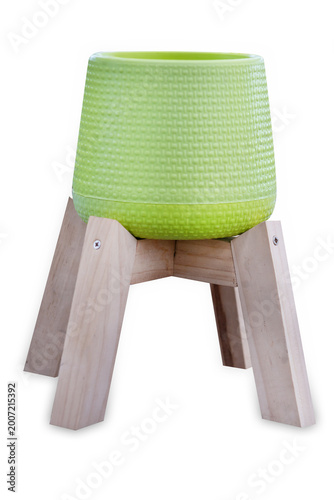 Top view of Green plastic pot on the wood standing mini size for plant, focus selective