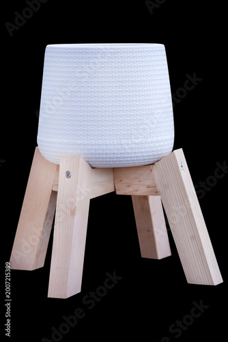 Top view of white plastic pot on the wood standing mini size for plant, focus selective