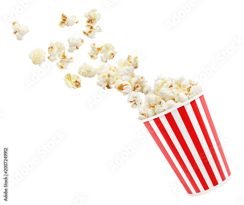 Popcorn flying out of striped cinema bucket, isolated on cutout transparent background
