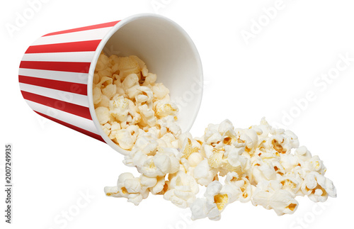 Popcorn spilling from striped bucket, isolated on cutout transparent background