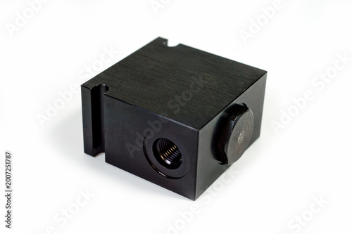 A hydraulic valve block used to control fluid flows in industrial systems.