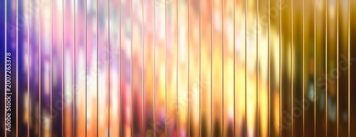 Abstract colorful vertical ribbed glass texture with glowing blurred lights background