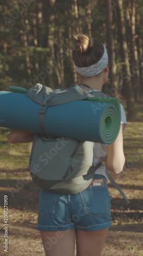 Hiking woman outdoors, Quiet forest hike in late afternoon with reflective atmosphere and camping essentials