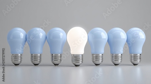 Seven modern light bulbs in a row, one glowing white among six blue, symbolizing innovation and standout ideas.