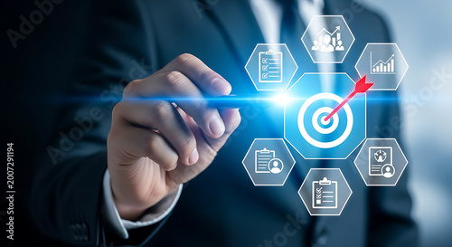 Professional touching a digital interface showcasing business goals, strategic planning, and target achievement for corporate success
