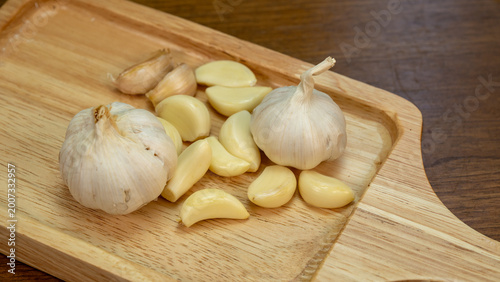 Fresh Organic Garlic Bulbs on Wood Platter Culinary Prep