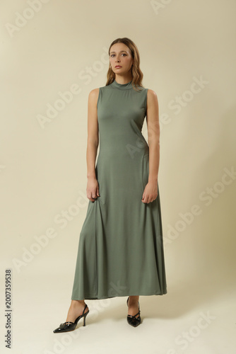 Studio Fashion Portrait of Woman in Green Sleeveless Roll Neck Stretch Cotton Maxi Dress – Comfortable Stylish Look
