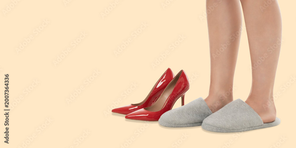 Obraz premium A woman displays high heels and slippers
