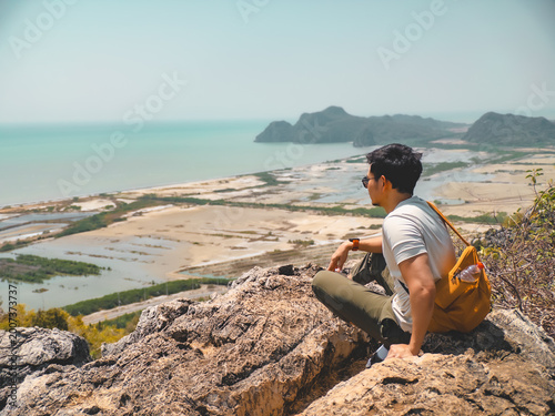 Quadro su tela Peaceful scene with man contemplating saltpans and distant islands