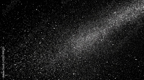 Fine white particles scatter diagonally across a deep black background suggesting cosmic dust or glitter.