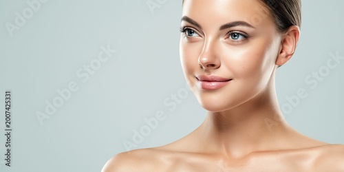 Close-up of a woman's face showcasing flawless skin and natural beauty © NovaVision