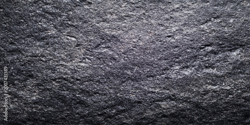 Fotografía Black fabric texture with a rough dark gray stone pattern creates a grunge mater