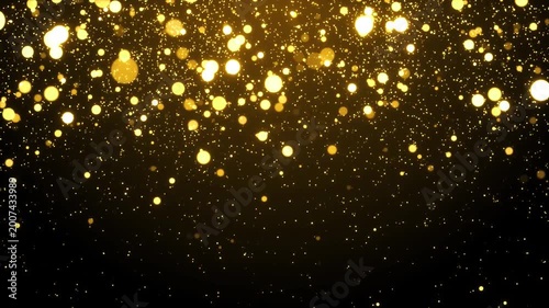 Abstract falling golden glowing bokeh particles and sparkling stardust lights on black background, magical luxury festive holiday concept animation.