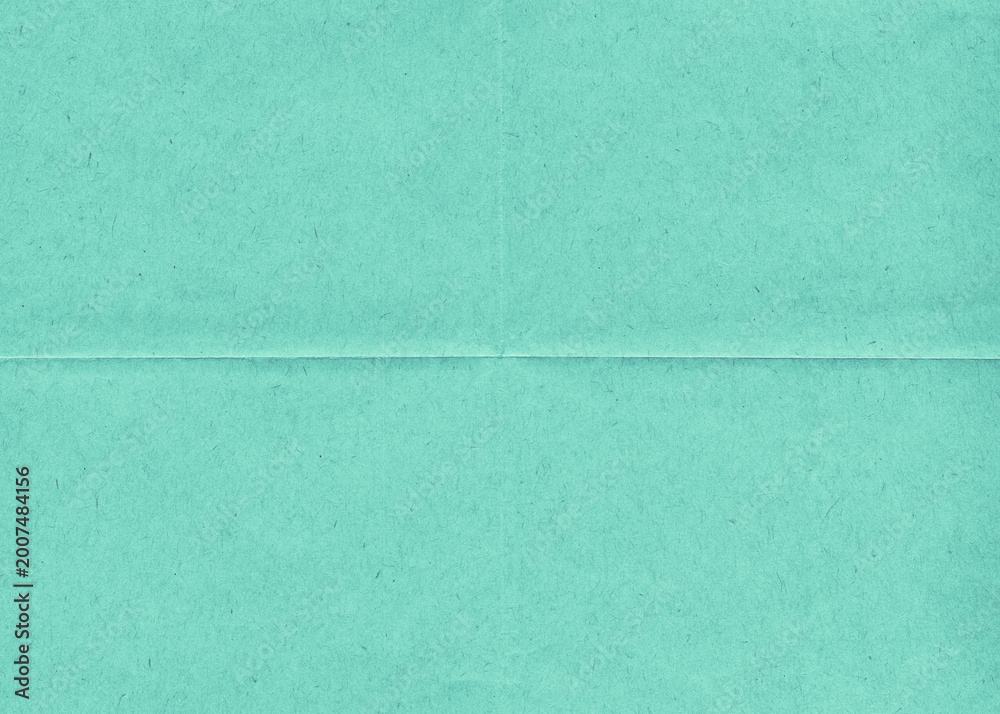 Fototapeta premium Vintage blank folded green paper. Old wrinkled paper background. Crumpled office paper. 