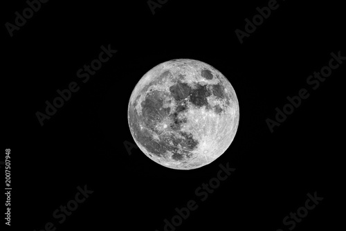 Quadro su tela Serene lunar landscape highlighting crater textures and starry background, fullm