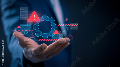 Cyber security warning alert system error notification on digital interface with businessman hand holding hologram gear dashboard for risk management automation control and problem solving technology