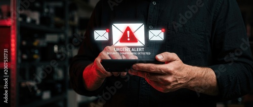 Urgent security alert notification cybersecurity incident digital communication dark environment close-up viewpoint data protection concept for enhanced online safety