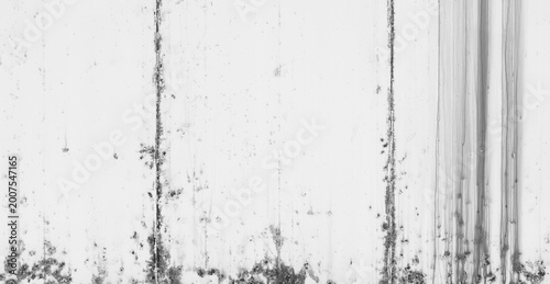 Tableau sur toile Full frame texture of a weathered white concrete wall with grunge stains, vertical water streaks, and industrial rust spots