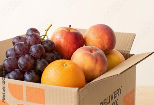 Assorted fresh fruit in delivery box