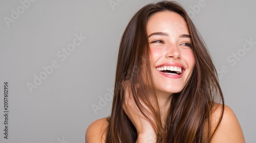 Happy woman laughing, showing healthy white teeth, copy space