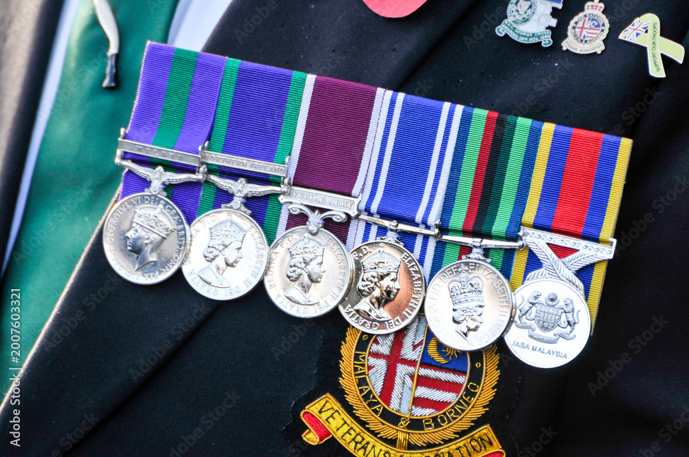 Fototapeta premium British military veteran wears six service medals, showcasing a proud and dignified representatopm of a lifetime of dedication and distinguished armed forces service