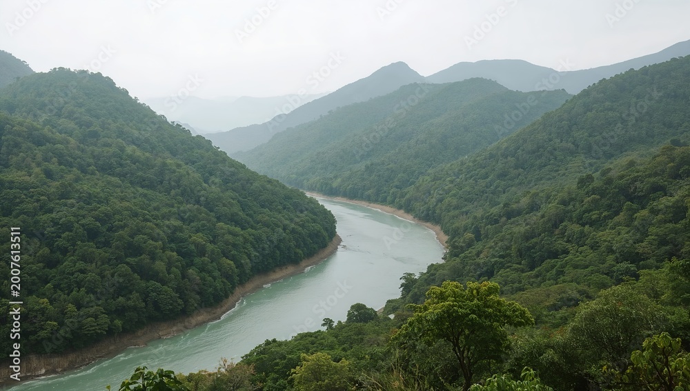 Fototapeta premium A serene river flowing through a lush mountain landscape, showcasing nature's beauty