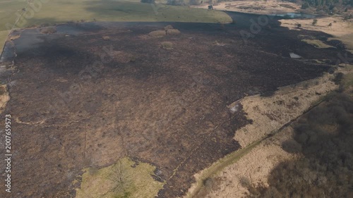 Aerial view of scorched land after wildfire in Somerset, UK