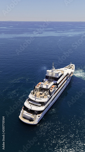 Aerial drone photo of luxury yacht with wooden deck cruising deep blue Aegean open sea