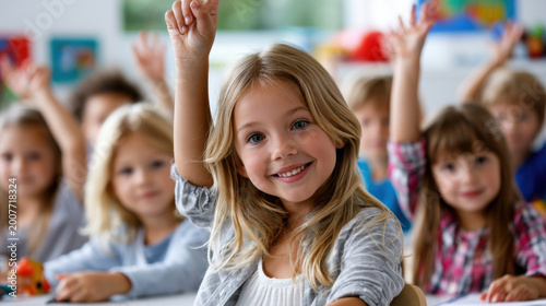 Children classroom school student learning education raising hand elementary happy group blonde girl boy child kid primary lesson teacher pupil friendship teamwork participation answer question