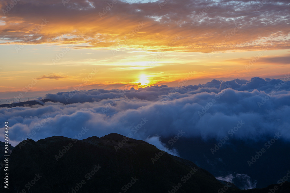 Fototapeta premium Sunset in Madeira where golden light meets the Atlantic and every moment feels like magic — nature, peace, and unforgettable views