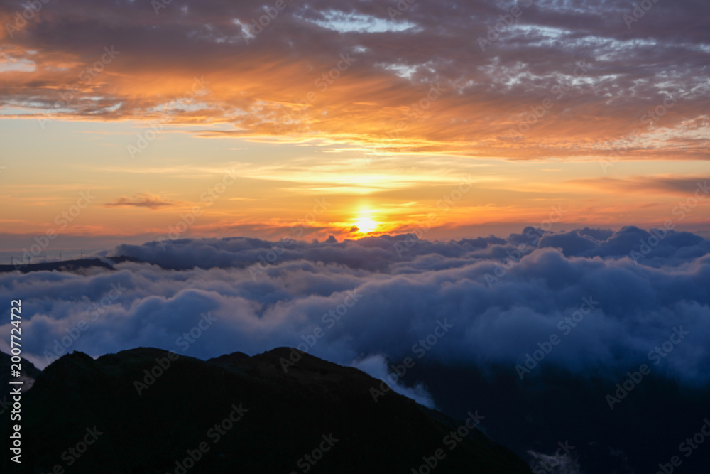 Fototapeta premium Sunset in Madeira where golden light meets the Atlantic and every moment feels like magic — nature, peace, and unforgettable views