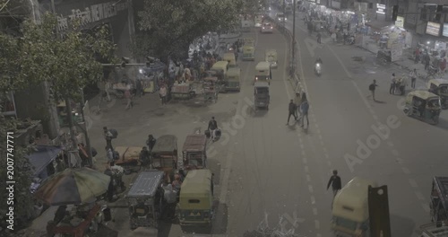 New Delhi, Delhi, India. Traffic On The Main Bazar road Street Paharganj. Cars, Motorcycles, Auto Rickshaw Or Tuk-tuk Moving On Street In night time. nighttime timelapse time lapse time-lapse