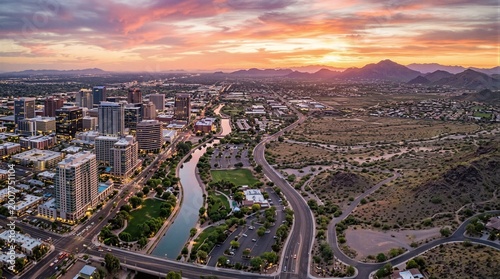 An aerial view of a city with mountains in the background.