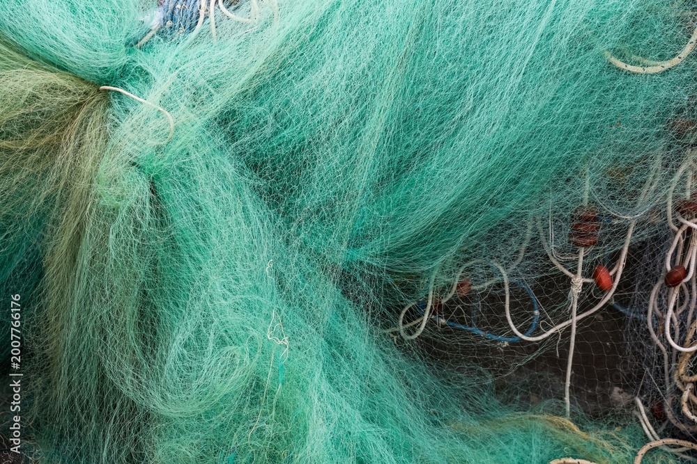 Fototapeta premium Fishing net texture with floats and rope