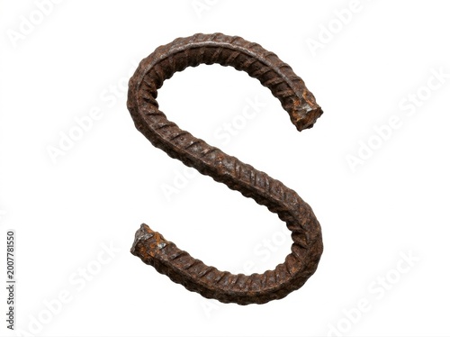 Brown rusted metal rebar bent into the shape of the letter s rusty