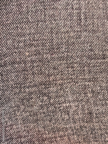 Denim texture background, black grey jeans fabric pattern close up, textile material surface for fashion design and apparel.