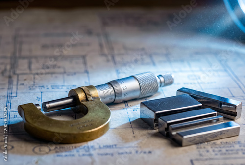 Greeting card base World Metrology Day with micrometer and gauge blocks on technical blueprint.