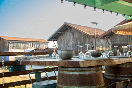 Oyster tasting table with a view of Port de la Hume harbor